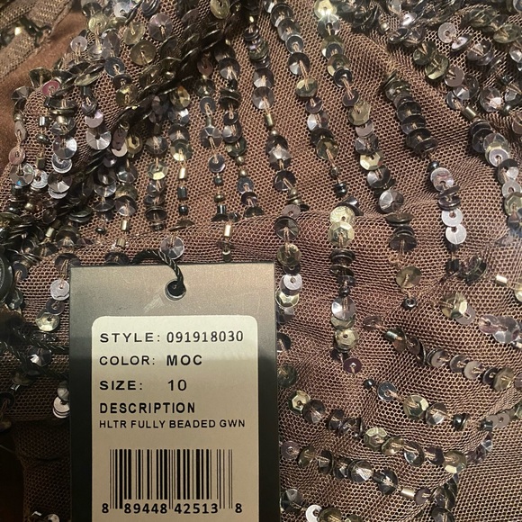 Adrianna Papell Halterneck
Fully Beaded Gown. - Picture 5 of 9